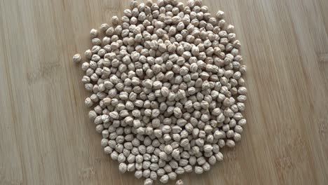 chickpeas on wooden table rotates