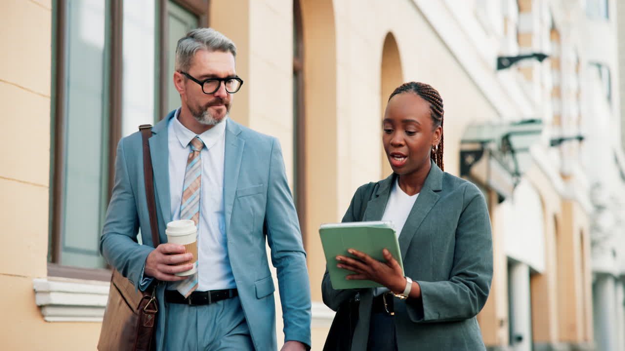 Business People Discussing Work on the Street