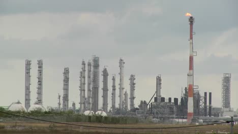 fire burns at an oil refinery