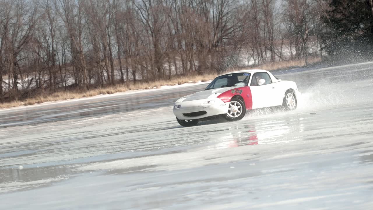 Shot of white red car drifting on a snow winter track