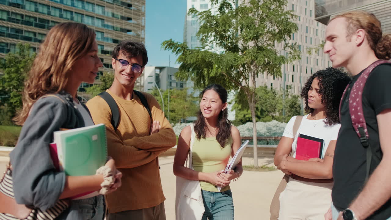 Millennial group of happy students, young friends standing in the street
