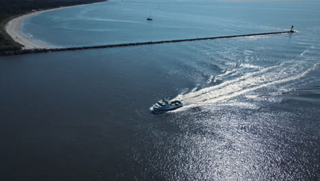 Boat-comes-around-curve-in-New-Jersey-Bay-in-Slow-Motion