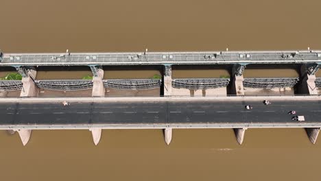 An-aerial-view-of-a-bridge-on-the-river