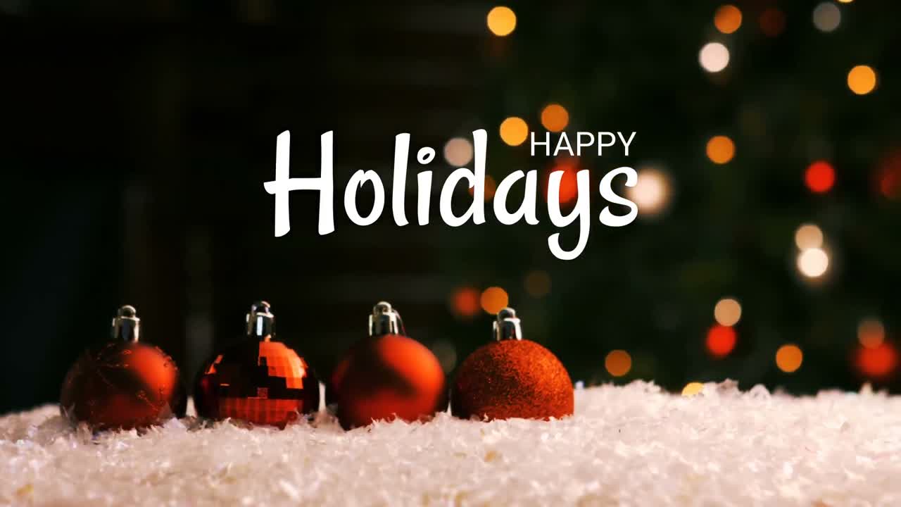 Happy holidays text and Christmas decorations with tree