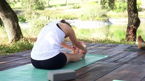 Girl-Stretching-Her-Boddy-Muscles-Outside-In-Green-Park