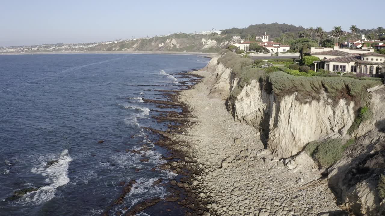 Palos Verdes luxury seaside villas atop coastal cliffs, aerial reveal view