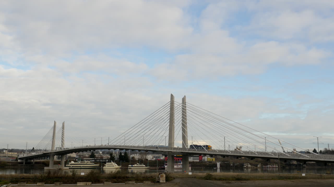 Tilikum Bridge Crossing with trams and buses in Portland Oregon USA in 4k High Resolution