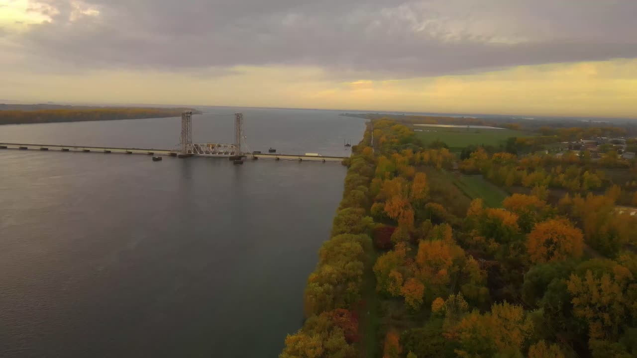 Quebec valley with a bridge crossing the river during autumn fall