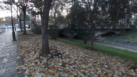 walk-through-Bajram-Curri-Boulevard-beside-the-Lana-River-in-Tirana,-Albania---Wide-push-in-Gimbal-shot