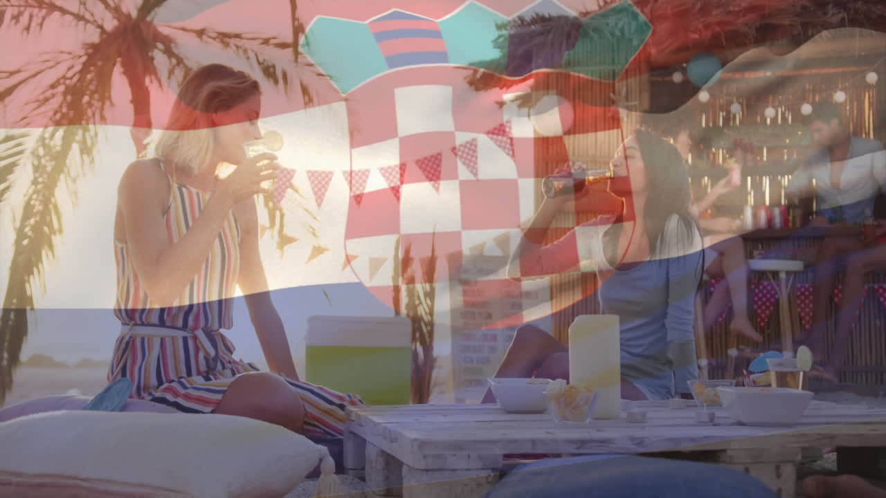 At beach bar, women holding drinks with Croatian flag animation overlaying scene