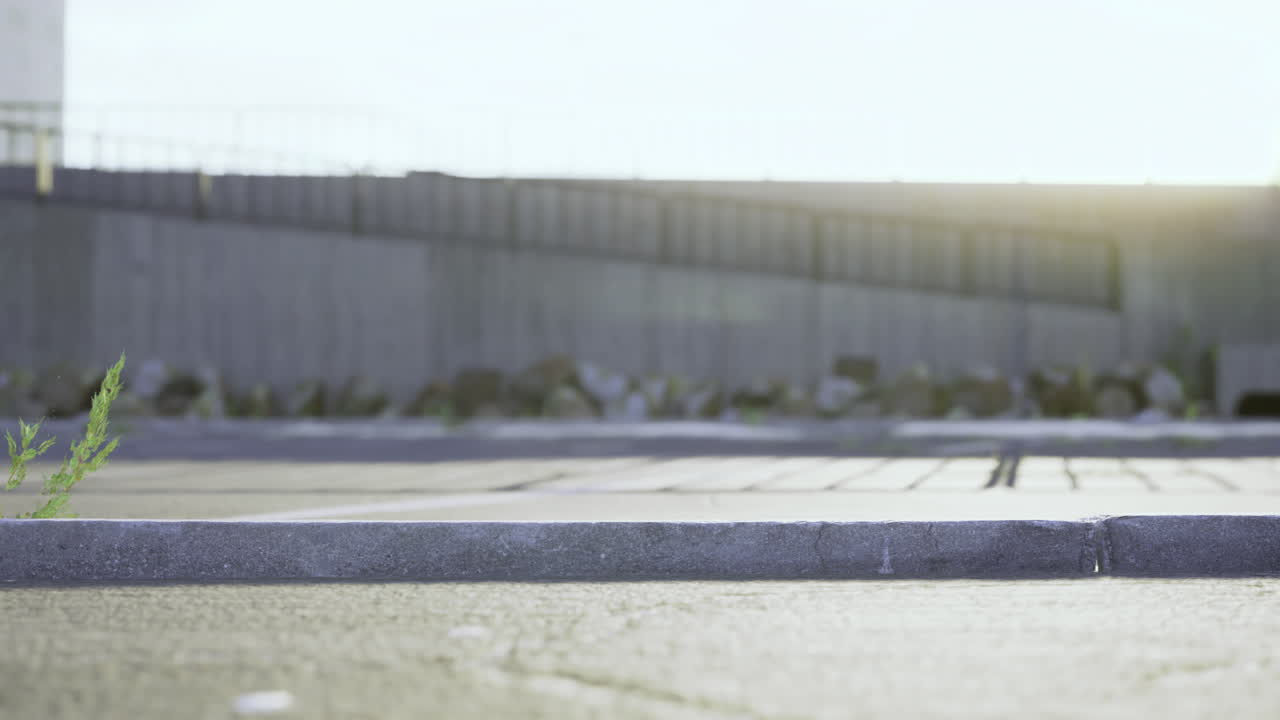 Sunlight illuminating a quiet urban walkway during early evening hours