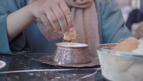 woman eating traditional turkish dessert/snack