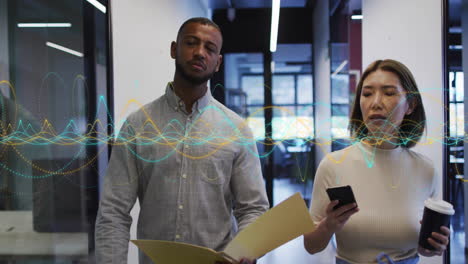 in office, business professionals walking with data visualization animation overlay