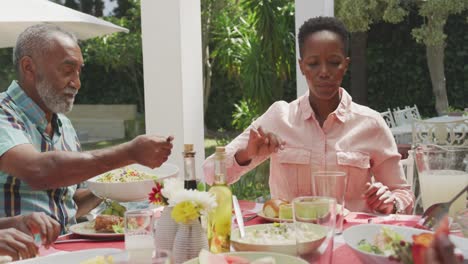 happy family eating together at table