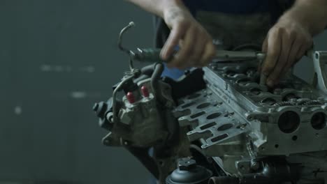 open car engine close-up. an auto mechanic in a garage repairing a car engine after removing a cover. car engine repair. car service