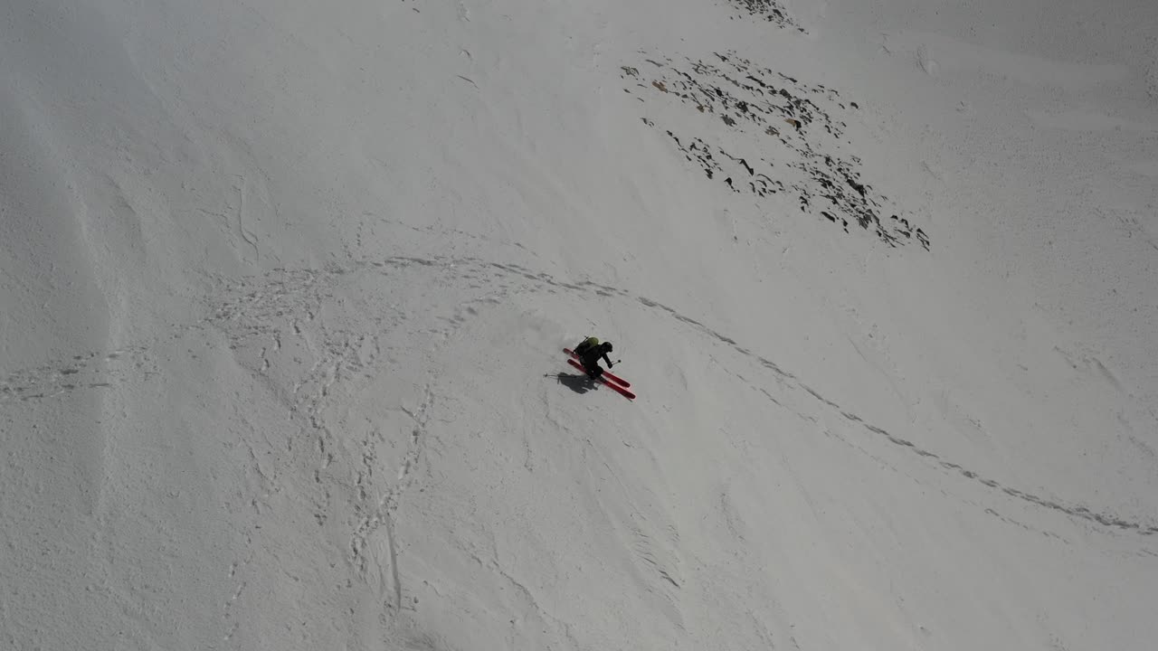 4K drone footage of skier in extreme terrain