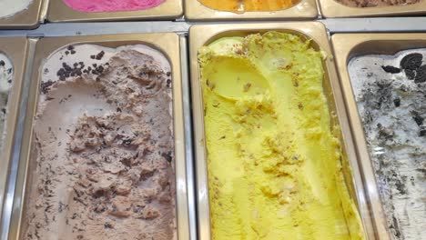 assortment of ice cream flavors in a display case