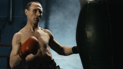 a boxer training in a smoky gym