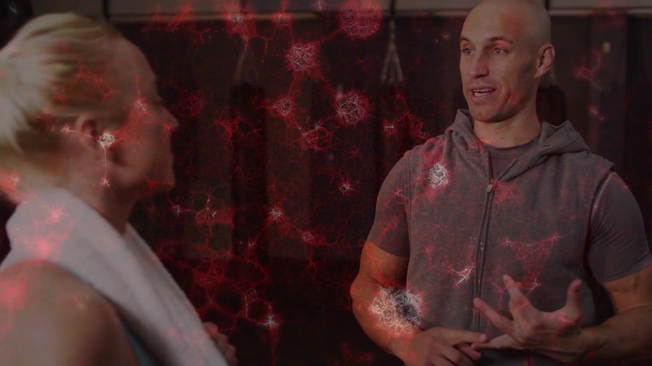 Vertical video: Gym trainer speaking and counting to coach client holding towel with red overlay