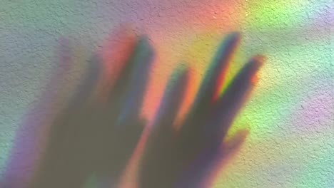 hands clapping. shadow on a rainbow background