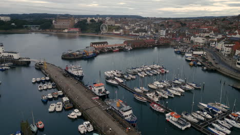 Rotating-Establishing-Drone-Shot-Over-Scarborough-Harbour-on-Overcast-day