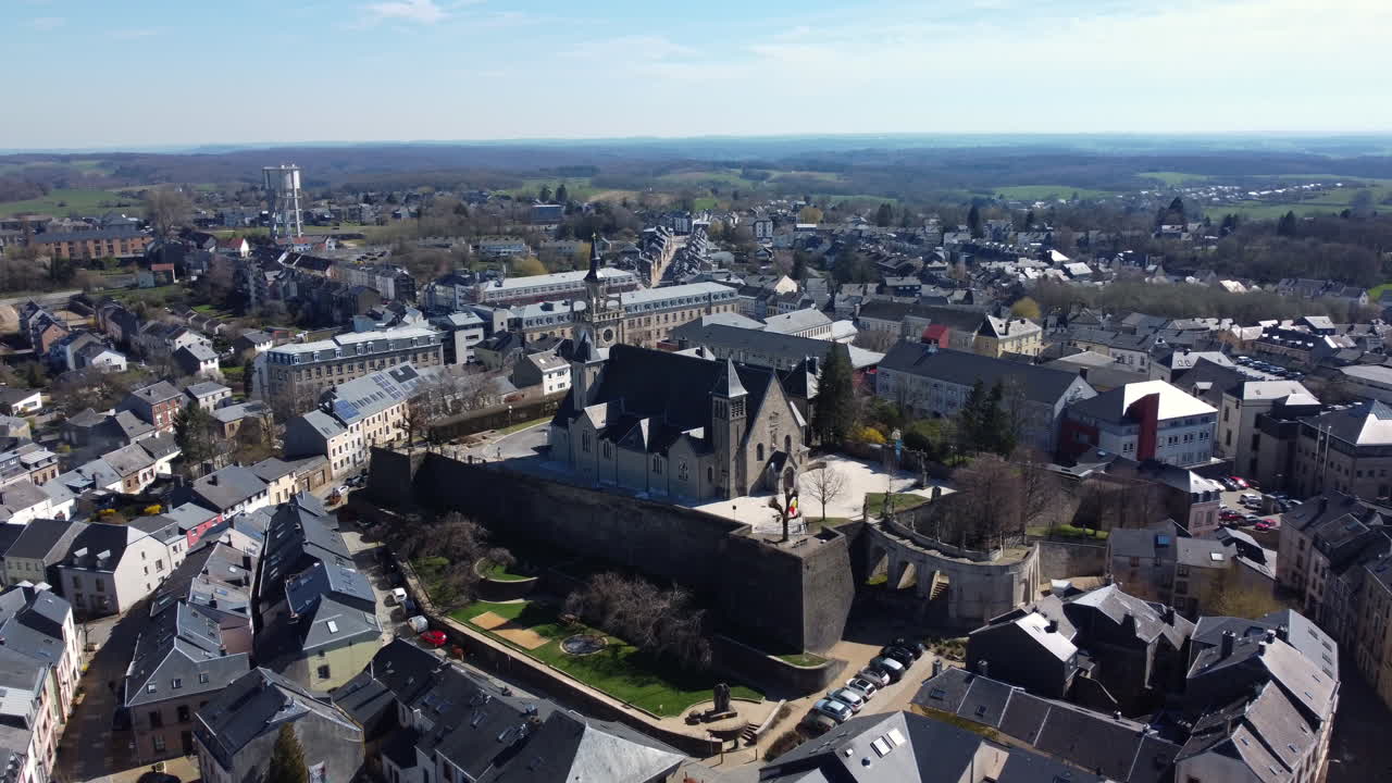 Aerial View of a European Town with Historical Walls and Church