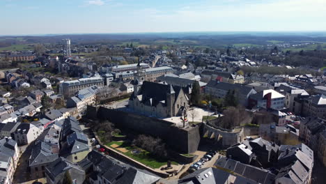 aerial view of a european town with historical walls and church