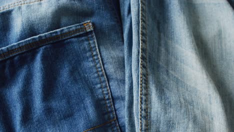 Close-up-of-jeans-with-different-shades-with-copy-space