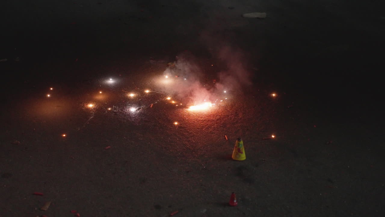 Diwali fireworks spinning in Bangalore streets at night in slow motion