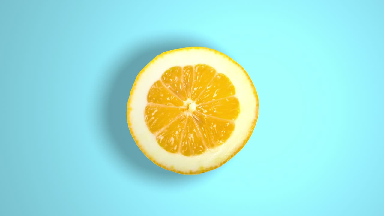 Orange rotating in the sunlight on a blue background.