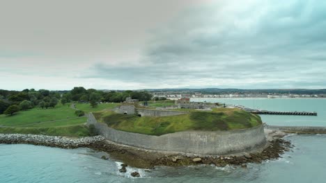 aerial view of weymouth's historic nothe fort on a cloudy day in dorset, uk - drone shot