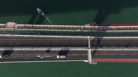 aerial drone bird's eye sideways shot of light traffic on cross bay bridge road network in tsuen kwan o, hong kong