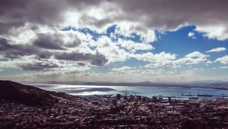 Animation-of-yellow-and-white-zigzag-lines-over-cloudy-sky,-coast-and-sea