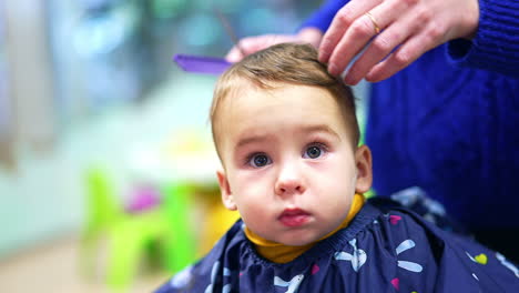 baby boy getting a haircut