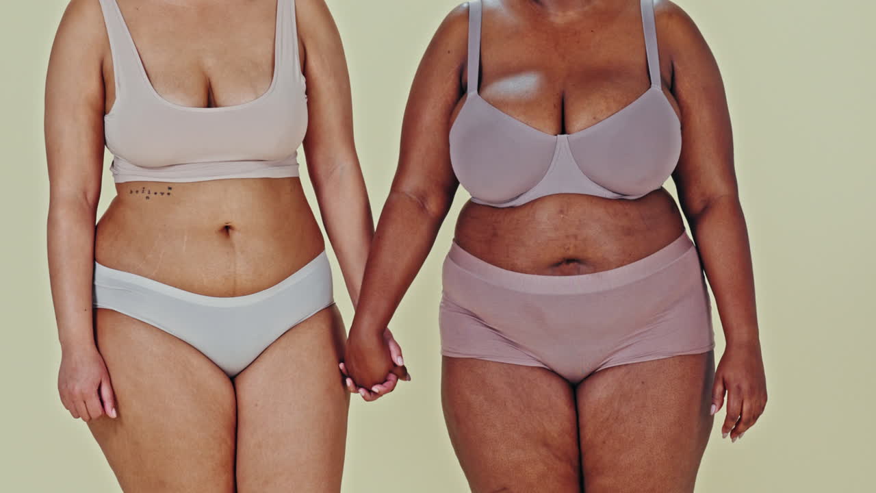 Two women showcasing body positivity