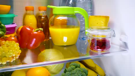 Fresh-raw-meat-on-a-shelf-open-refrigerator