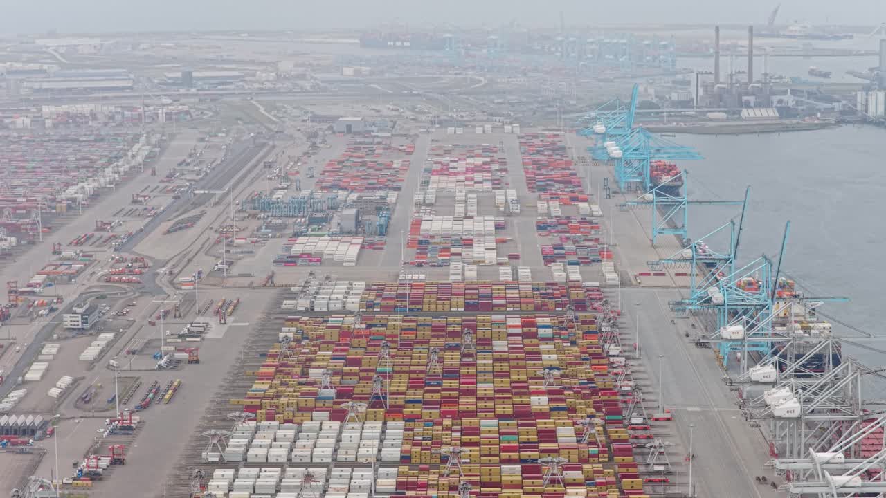 Rotterdam container harbor, logistics ships loading and unloading freight