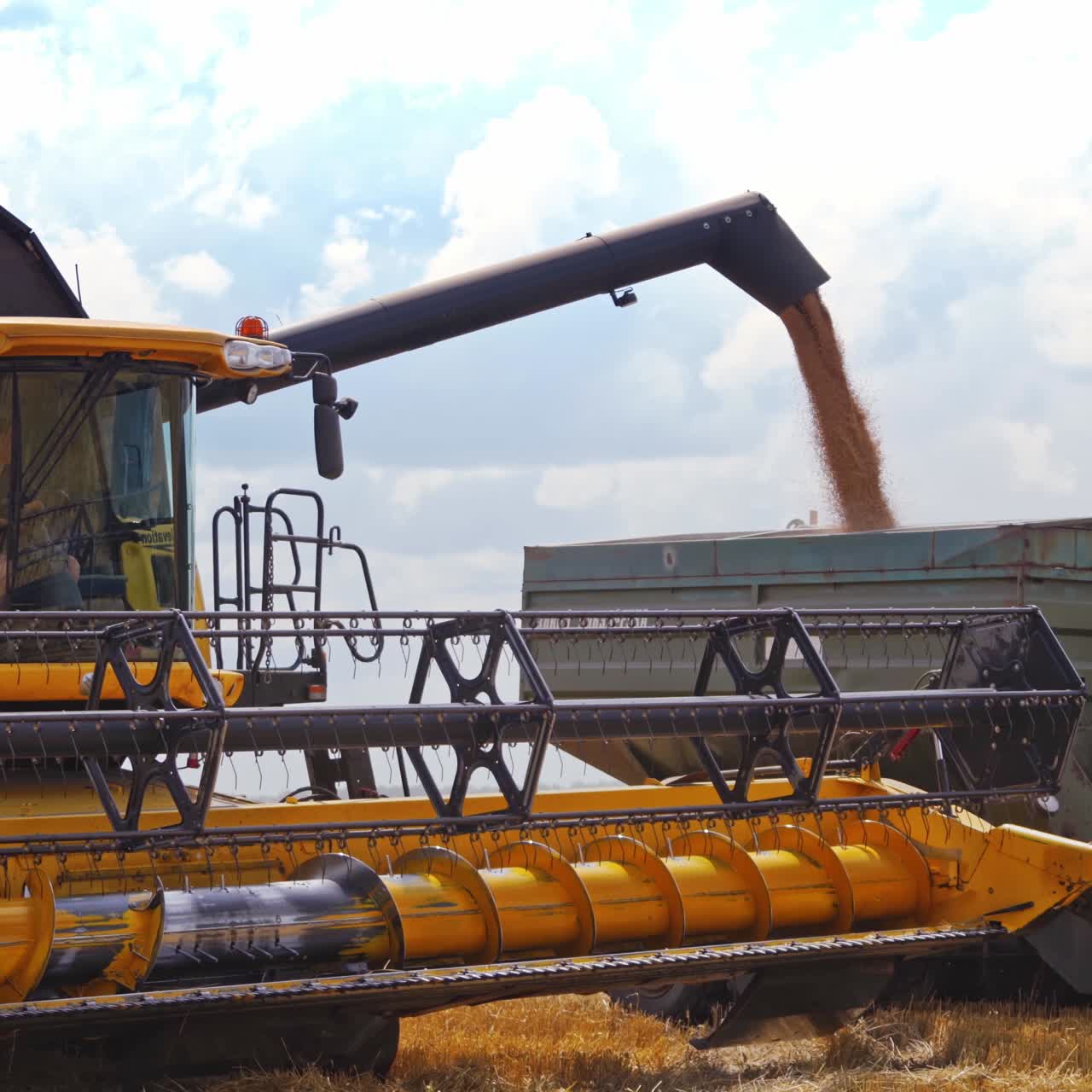 Machines harvesting in field