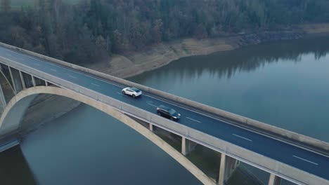 white car moving on bridge road