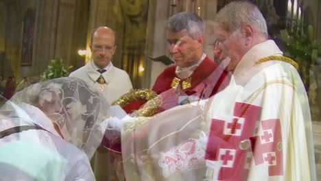 Inside-Catholic-Notre-Dame-Cathedral-in-Paris-religious-visitors-kiss-the-holy-relic-1