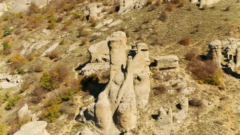 aerial view of unique rock formations in autumnal mountains