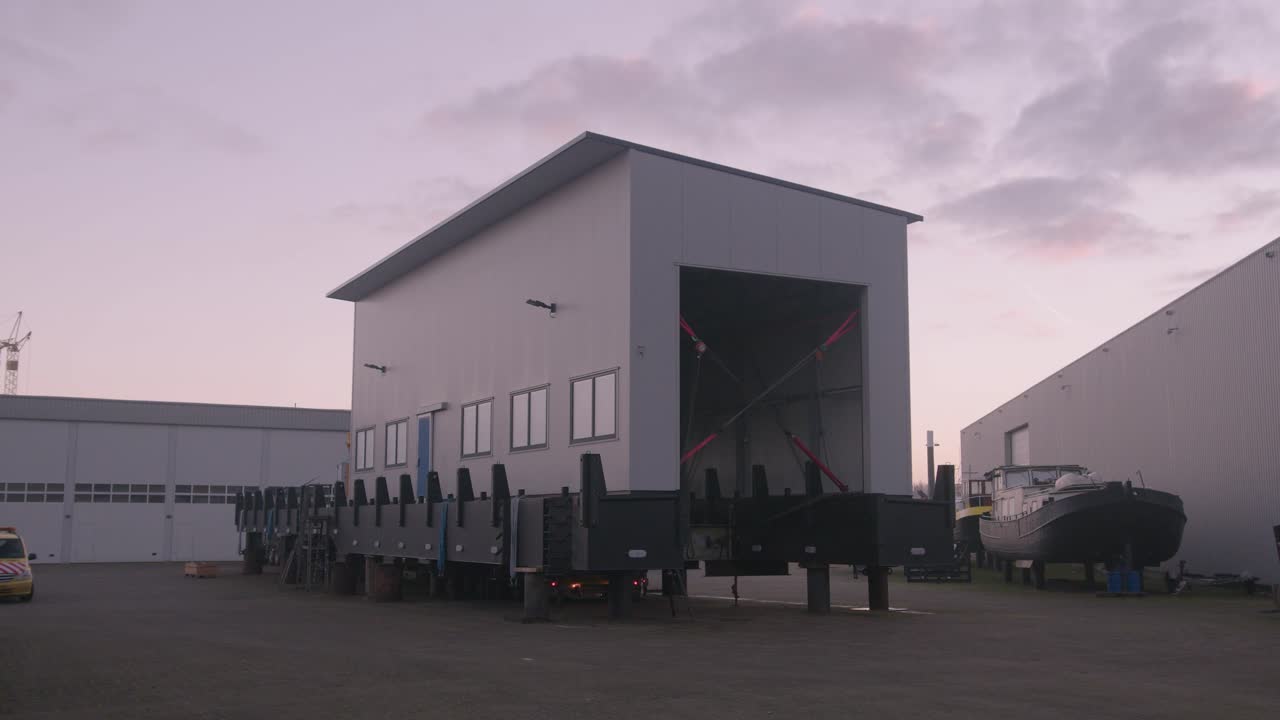 Newly build ship loaded onto flatbed ready to be shipped to launching pad