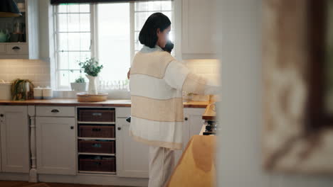 coffee, kitchen and mother with baby