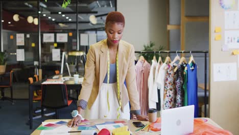 portrait of happy african american businesswoman looking at camera at office