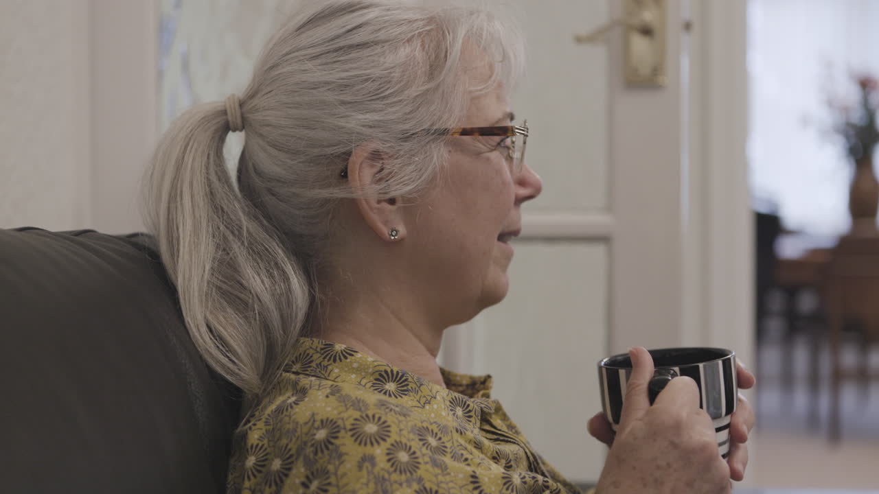 Elderly woman with coffee