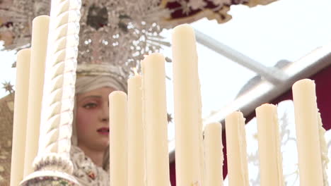 religious procession with candles and statue