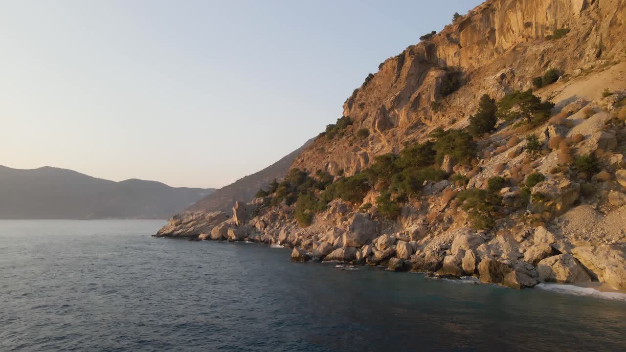 Drone approaching rock bound formation in oludeniz natural reserve, turkey holiday travel destination