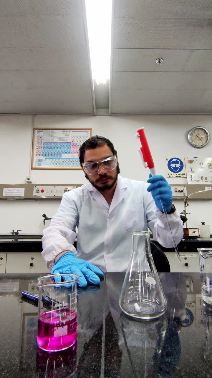 Scientist in Action with Pink Chemical Solution