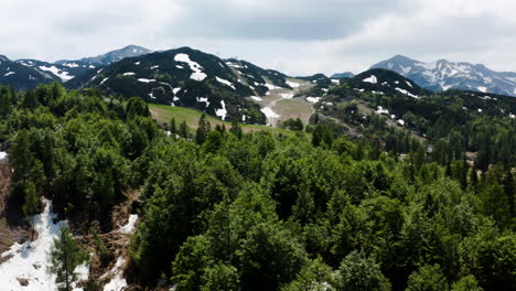 patches of snow at the rugged landscape of vogel mountain in triglav national park in slovenia