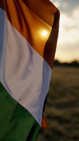 indian flag waving in the wind at sunrise/sunset
